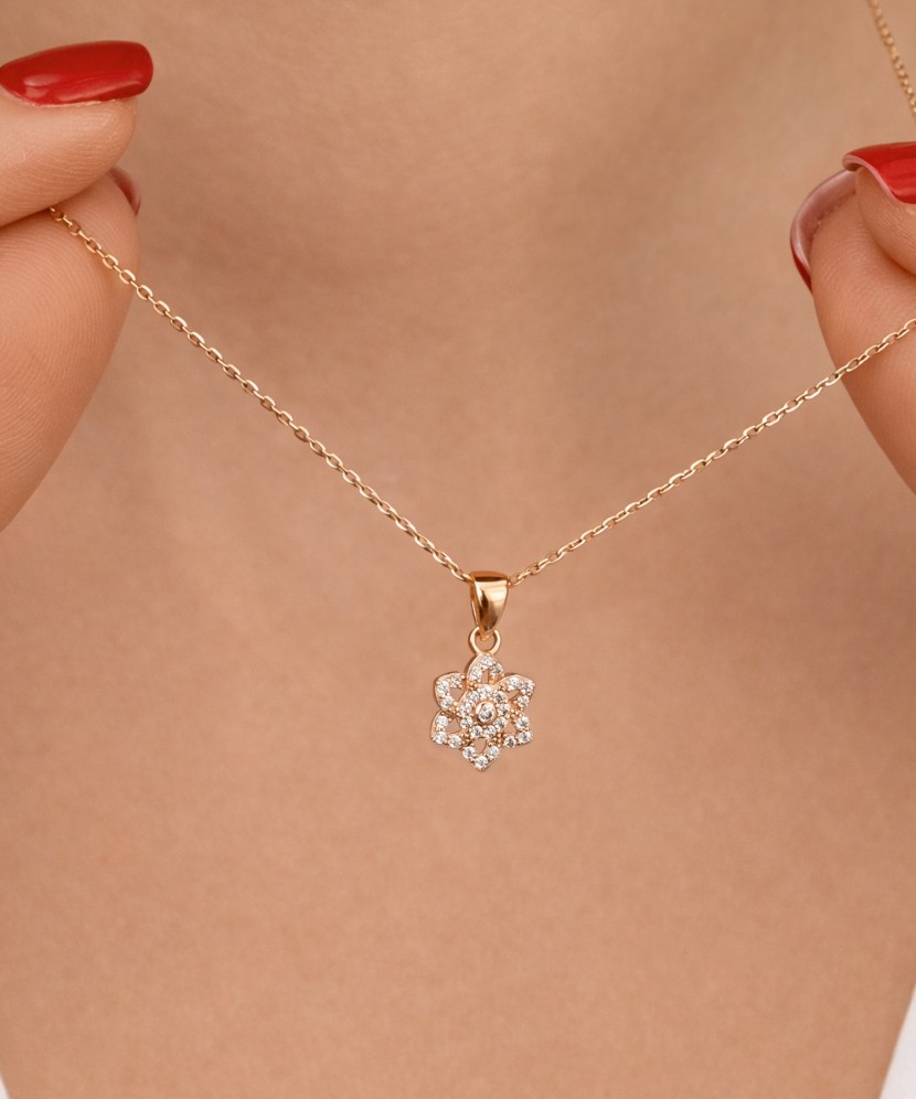 Gold pendant with zircons