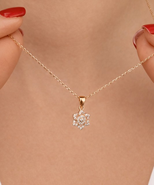 Gold pendant with zircons