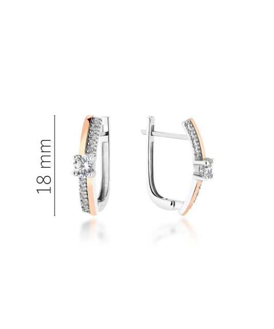 Hopeiset korvakorut peittää kullalla zirkoneilla