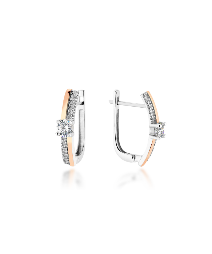 Hopeiset korvakorut peittää kullalla zirkoneilla