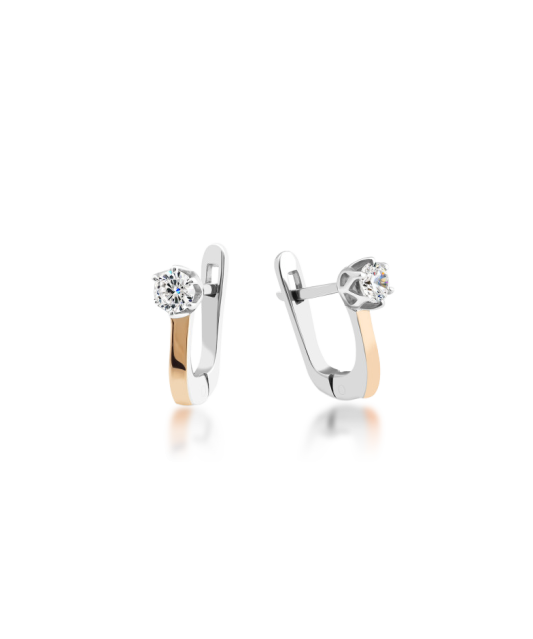 Hopeiset korvakorut peittää kullalla zirkoneilla