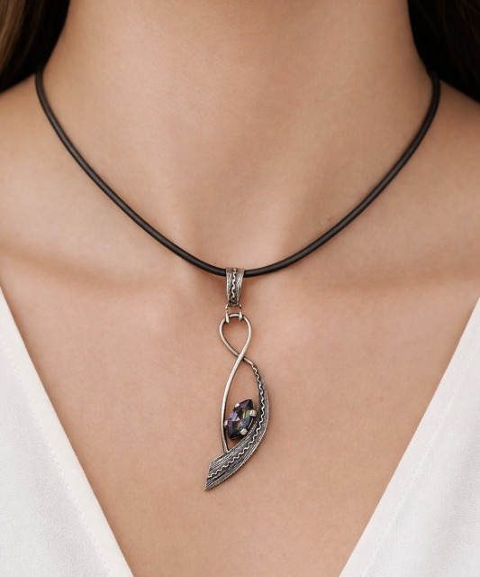 Silver pendant with mystical topaz
