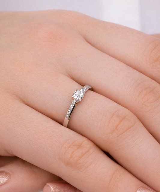 White gold ring with zircons