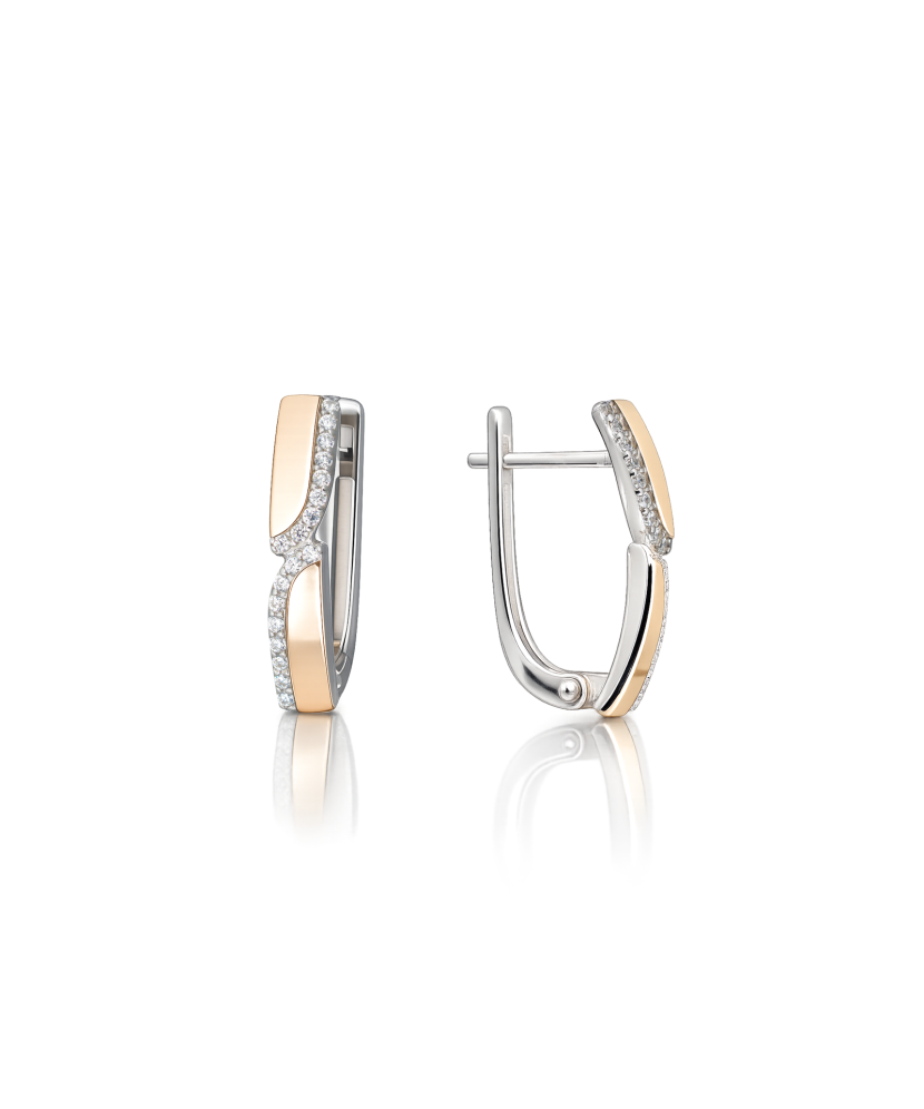 Hopeiset korvakorut peittää kullalla zirkoneilla