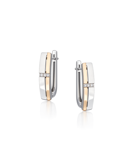 Hopeiset korvakorut peittää kullalla zirkoneilla