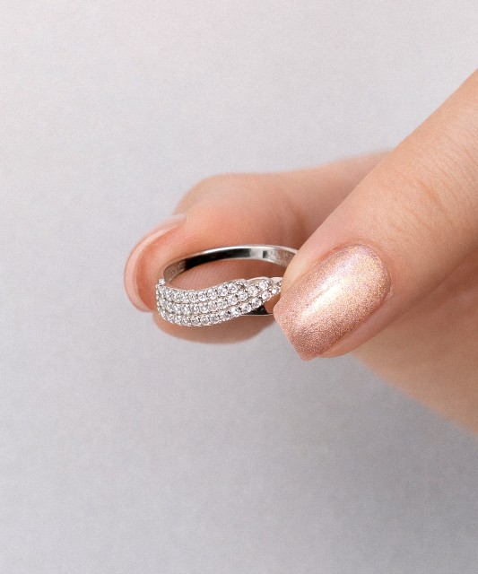 White gold ring with zircons