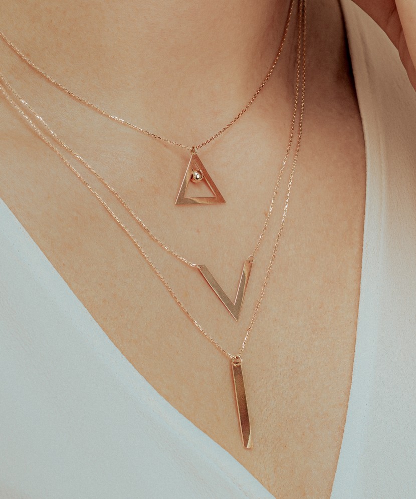 Triple gold chain with pendants