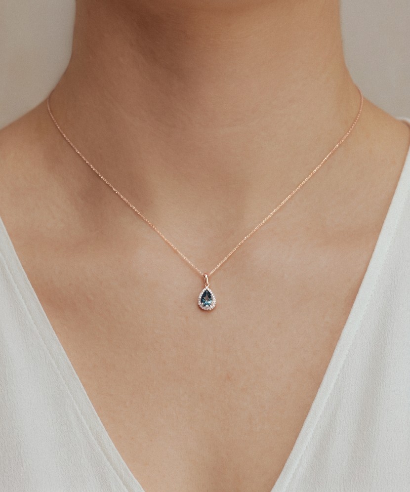 Gold pendant with diamonds and London topaz