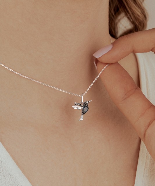 White gold pendant with diamonds, black diamonds and London topaz