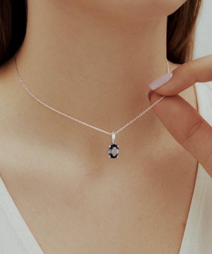 White gold pendant with diamonds and London topaz