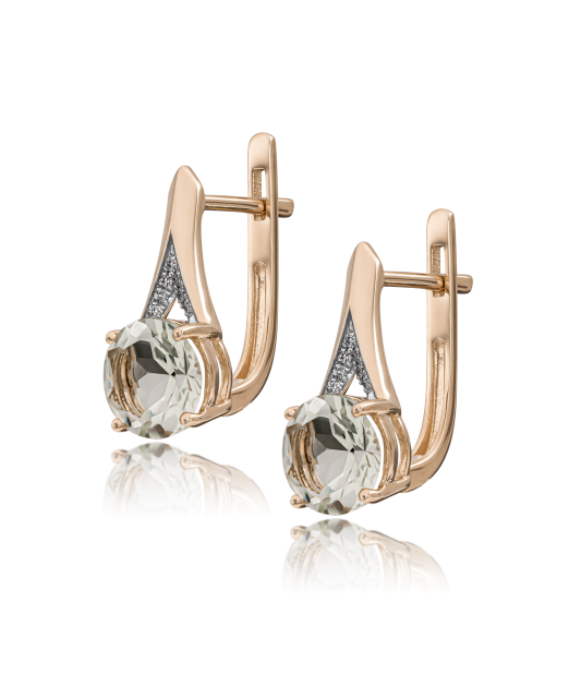 Gold earrings with diamonds and topazes