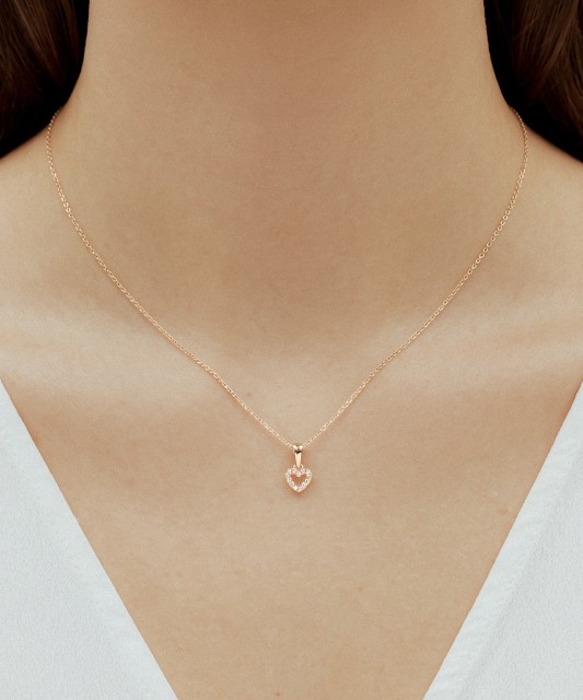 Gold pendant with zircons "heart"