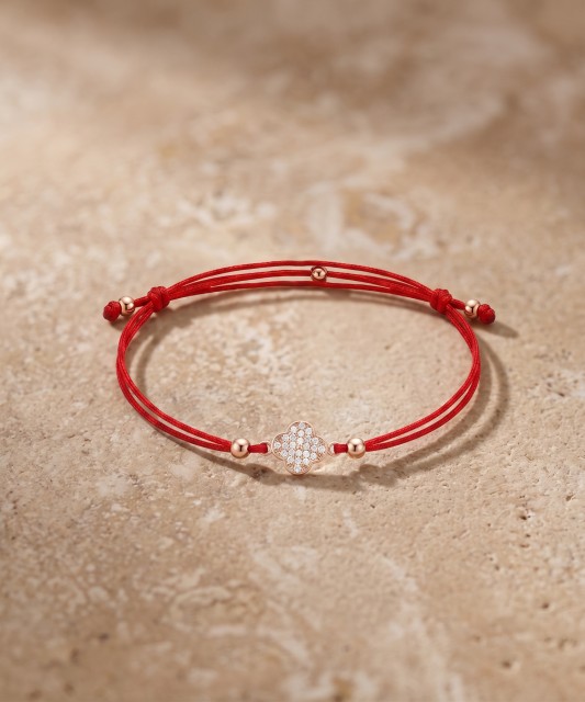 Red string bracelet with gold zirconia pendant