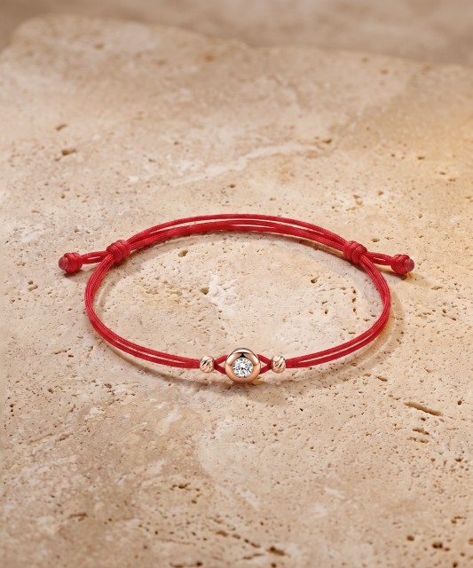 Red string bracelet with gold zirconia pendant