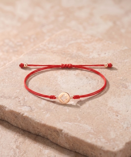 Red string bracelet with gold pendant