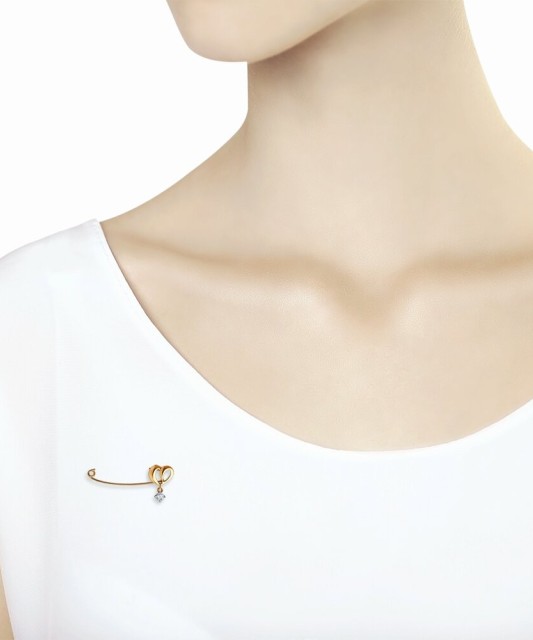 Gold brooch with zirconium "heart"