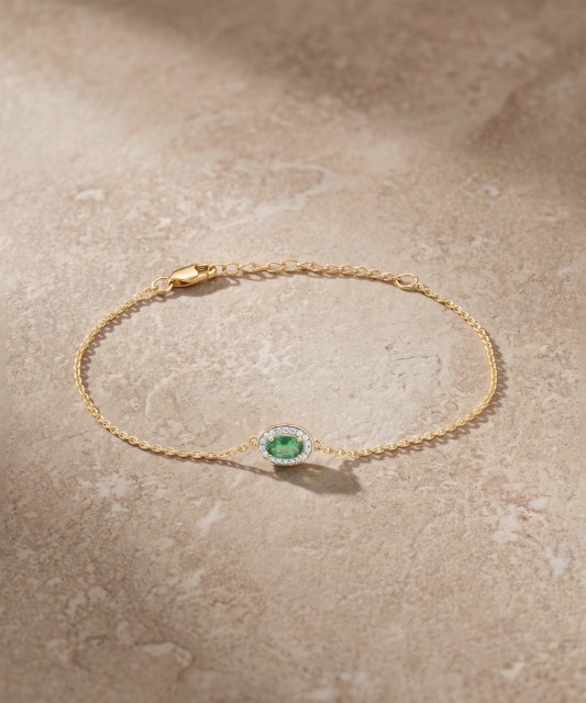 Yellow gold bracelet with emerald and diamonds