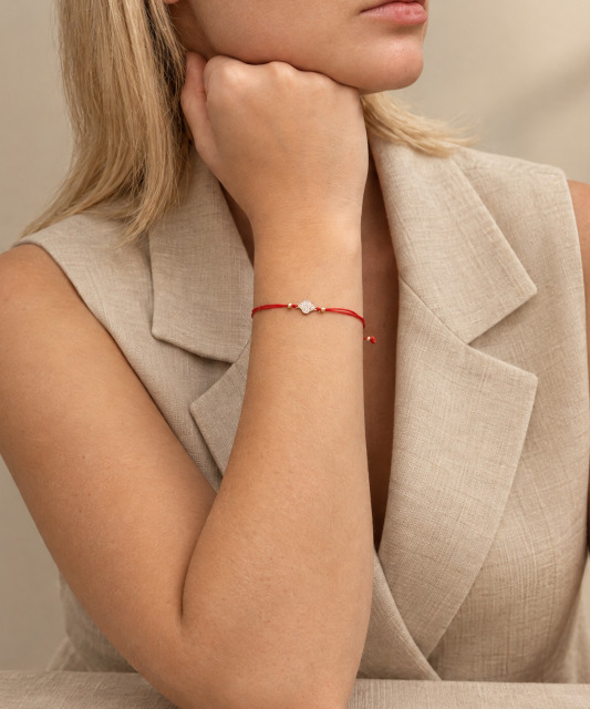 Red string bracelet with gold zirconia pendant