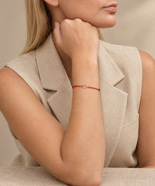 Red string bracelet with gold zirconia pendant “Heart”