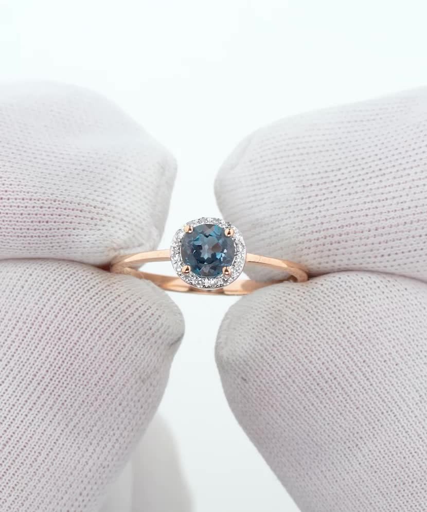 Gold ring with diamonds and London topaz