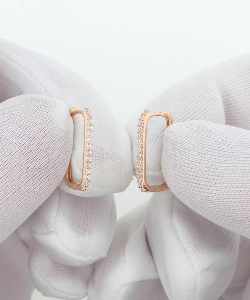 Gold earrings with zircons