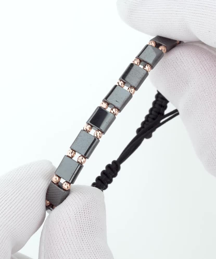 Black string bracelet with gold And Hematites