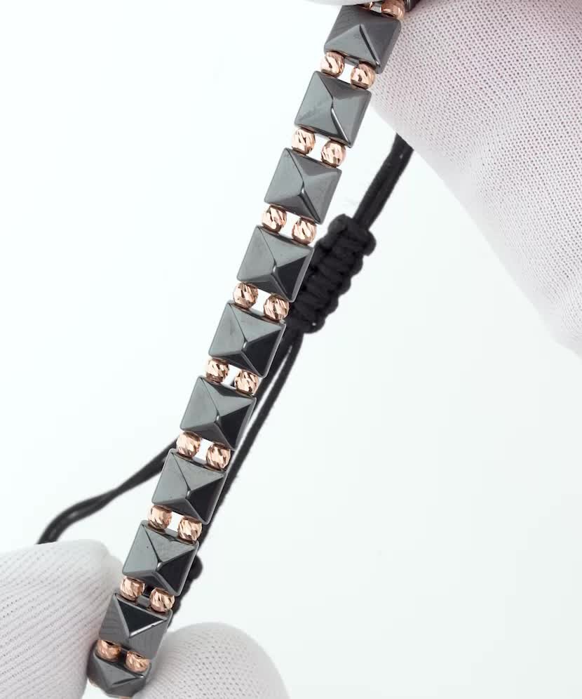 Black string bracelet with gold And Hematites