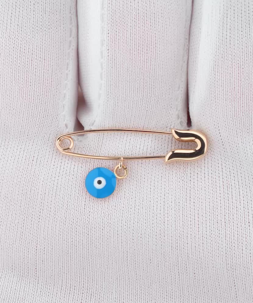 Gold brooch with enamel