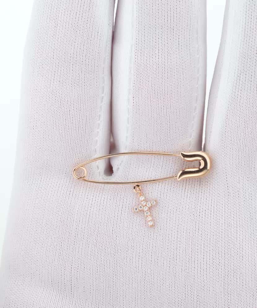 Gold brooch with zircons