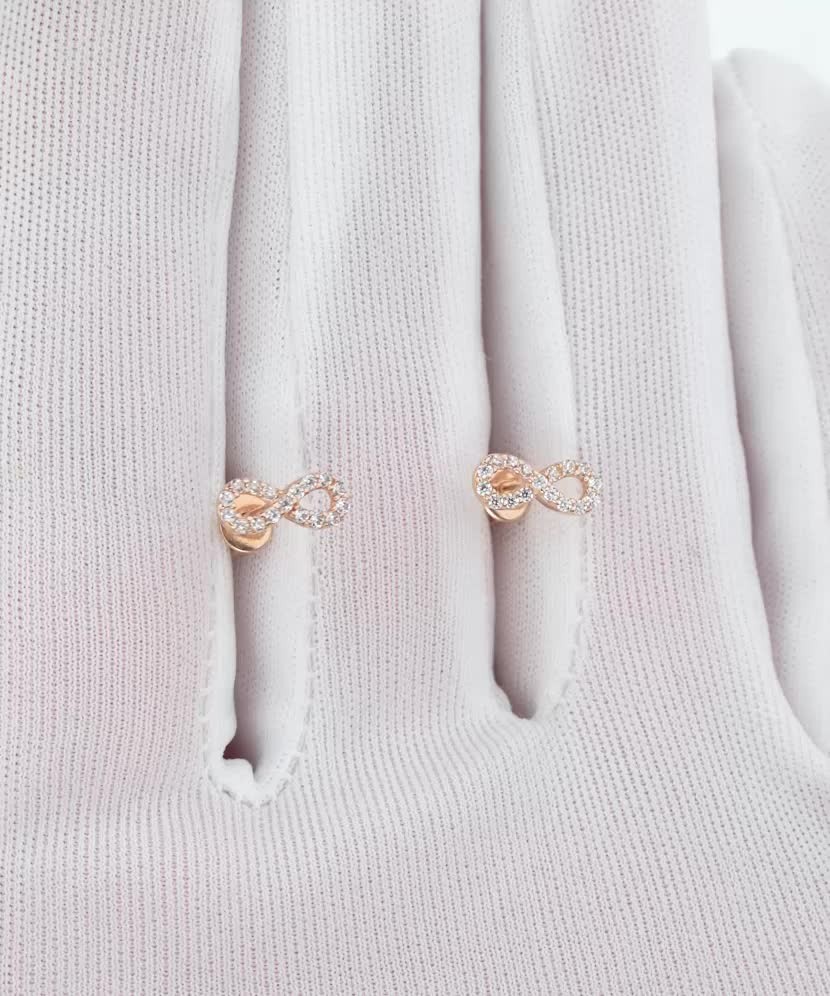 Kultaiset korvakorut zirkoneilla "ääretön"