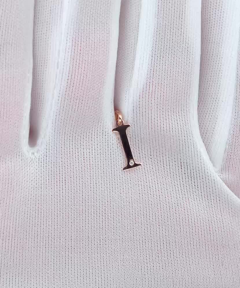 Gold pendant with diamond letter I