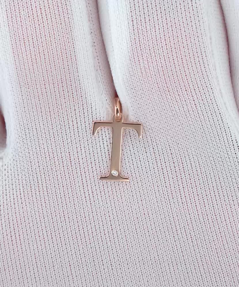 Gold pendant with diamond letter T
