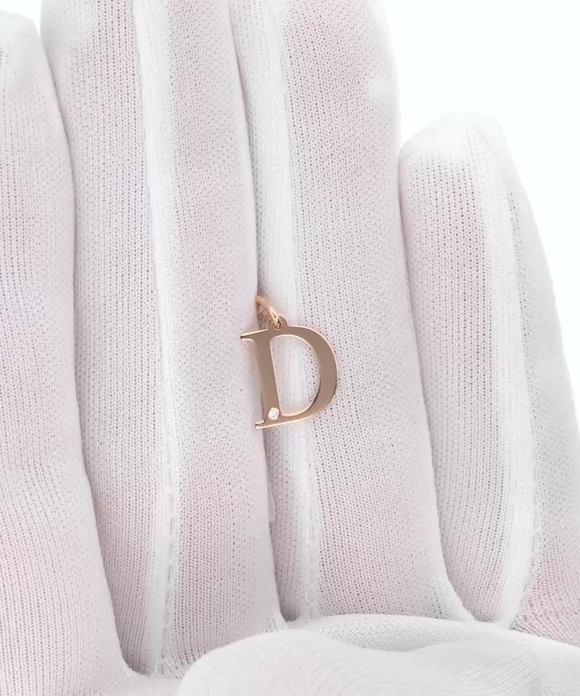 Gold pendant with diamond letter D