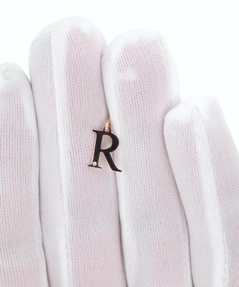 Gold pendant with diamond letter R