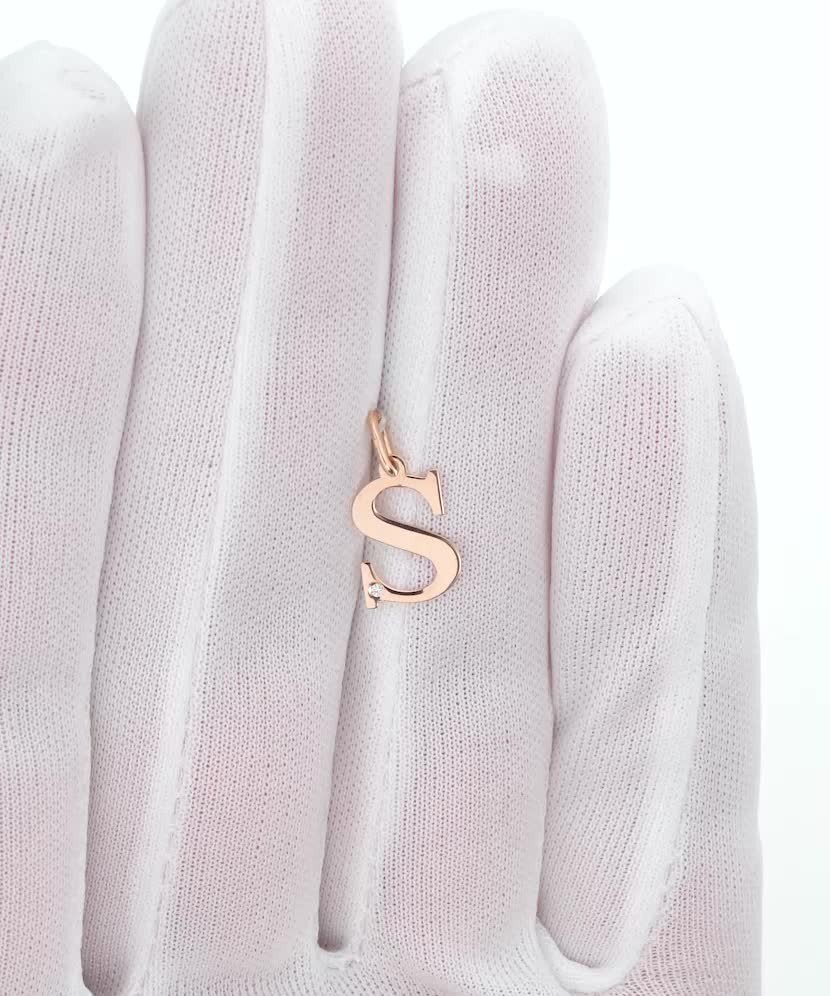 Gold pendant with diamond letter S