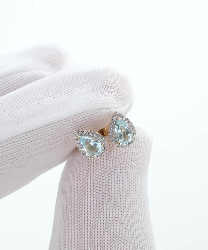 Yellow gold earrings with diamonds and white topaz