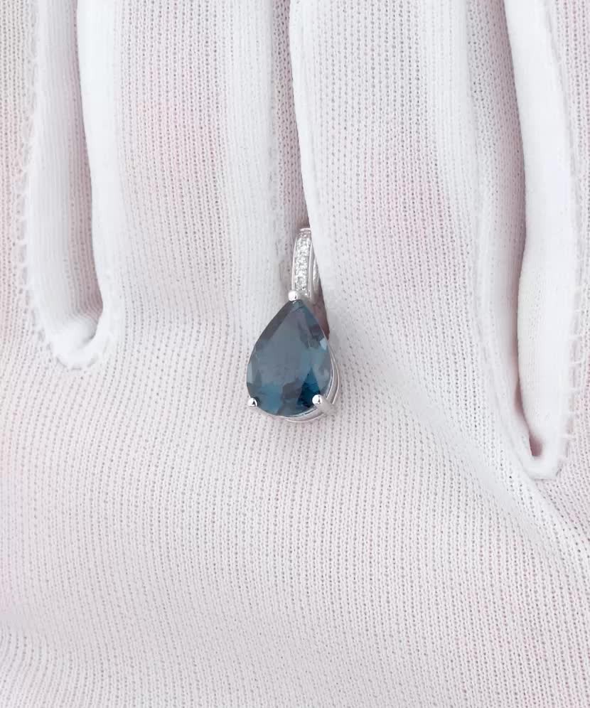 White gold pendant with diamonds and London topaz