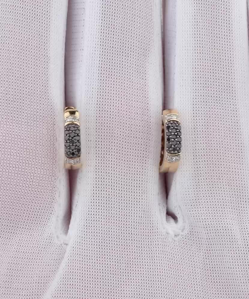 Keltaiset kultaiset korvakorut timanteilla