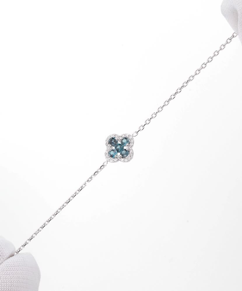 Valkokultainen rannekoru timanteilla ja Lontoon topaasilla