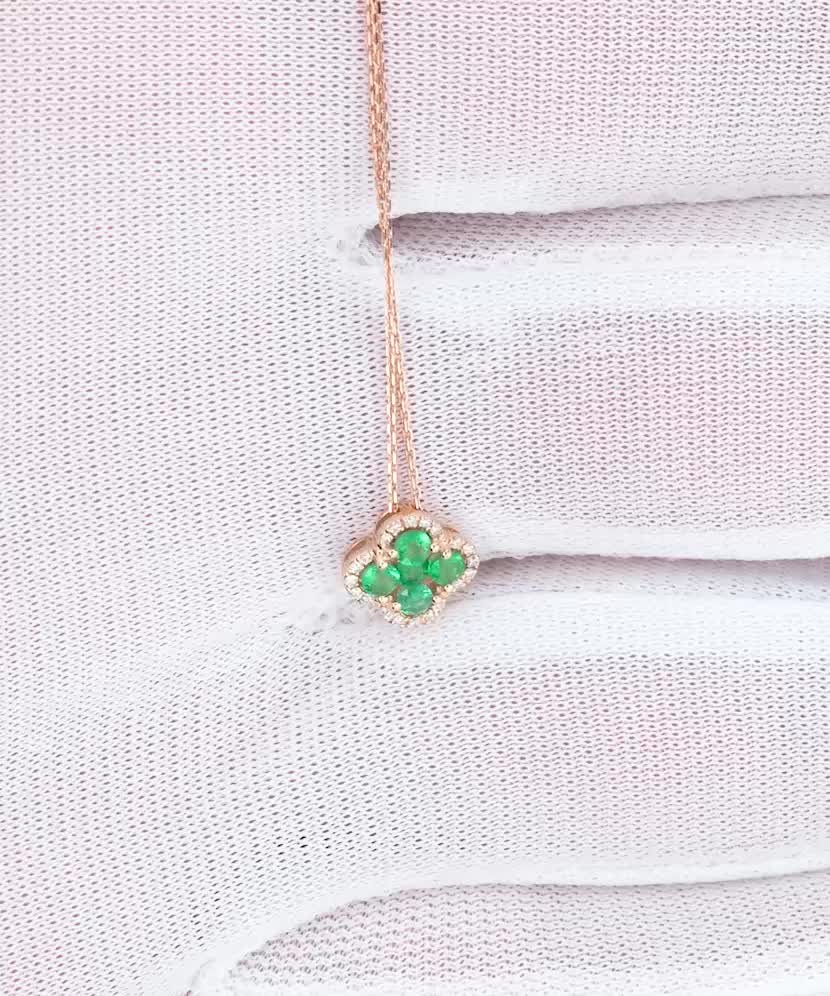 Gold chain with emerald and diamond pendant