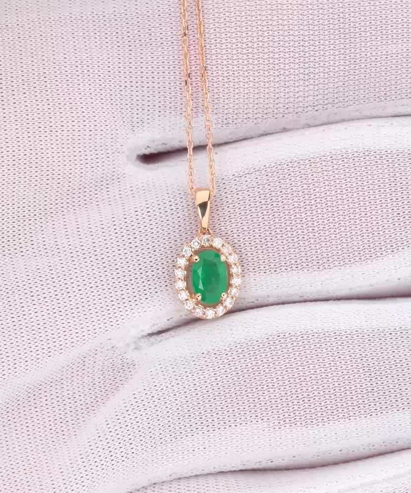 Gold chain with emerald and diamond pendant