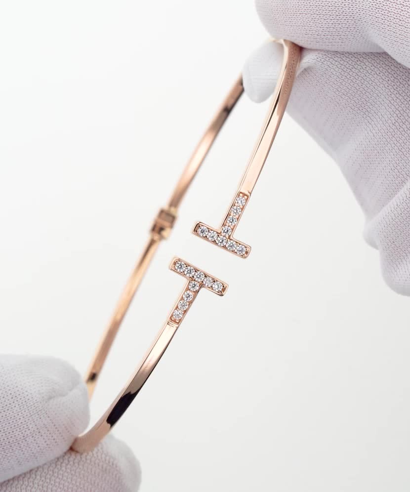 Gold hard bracelet with zircons