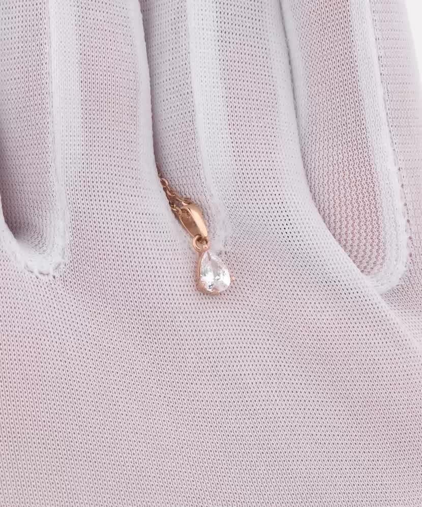 Gold pendant with zircons