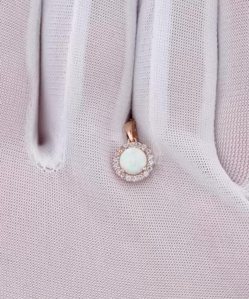 Gold pendant with opal and zircons