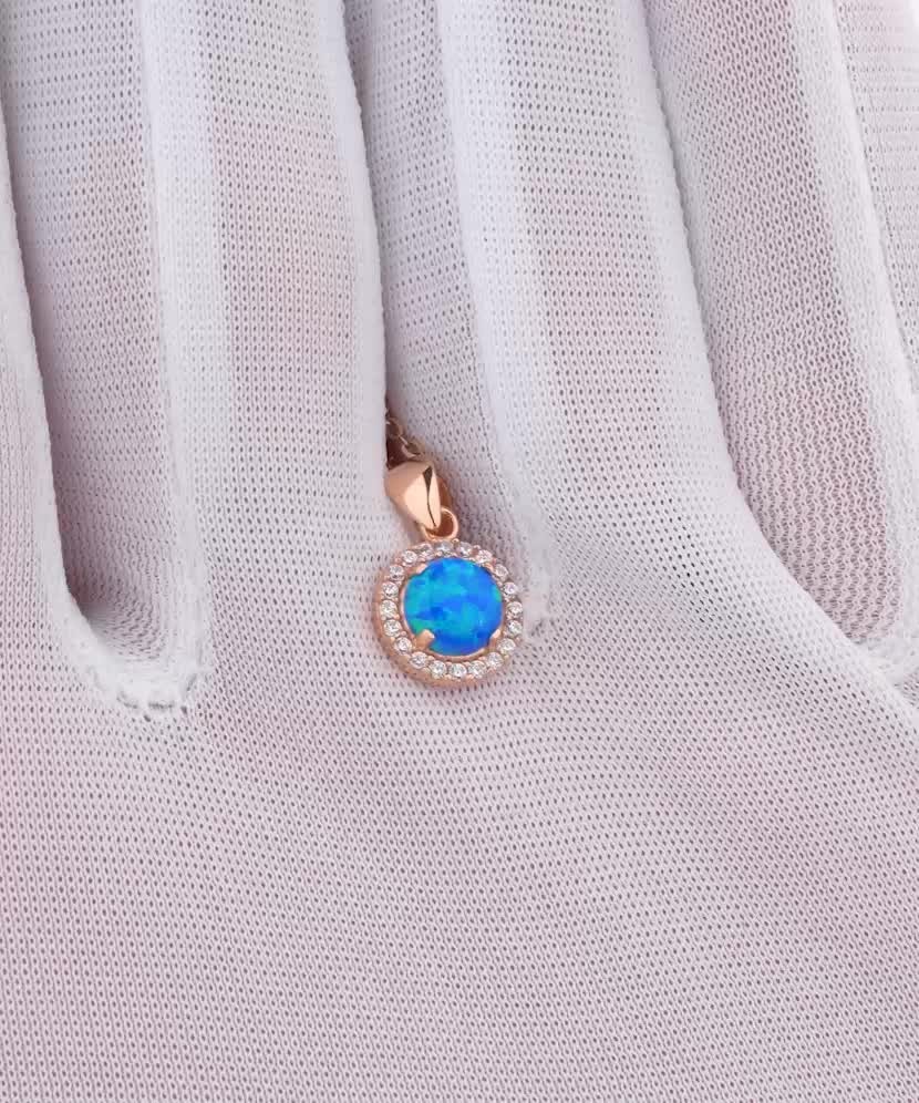 Gold pendant with opal and zircons