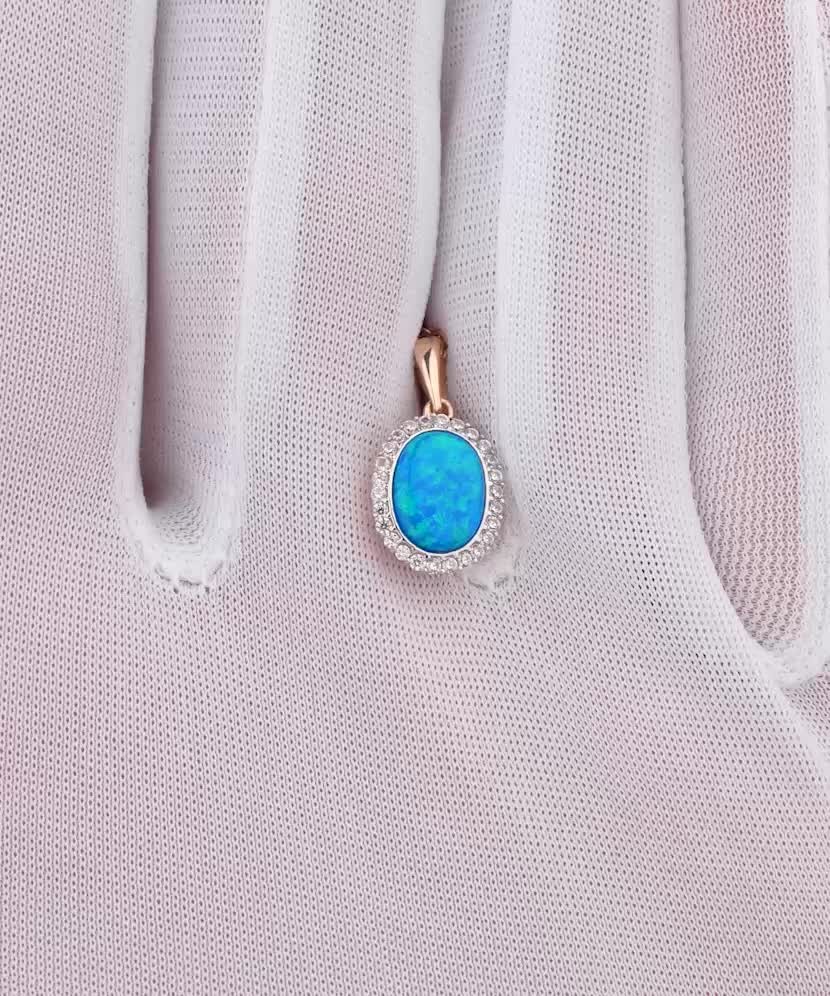 Gold pendant with opal and zircons