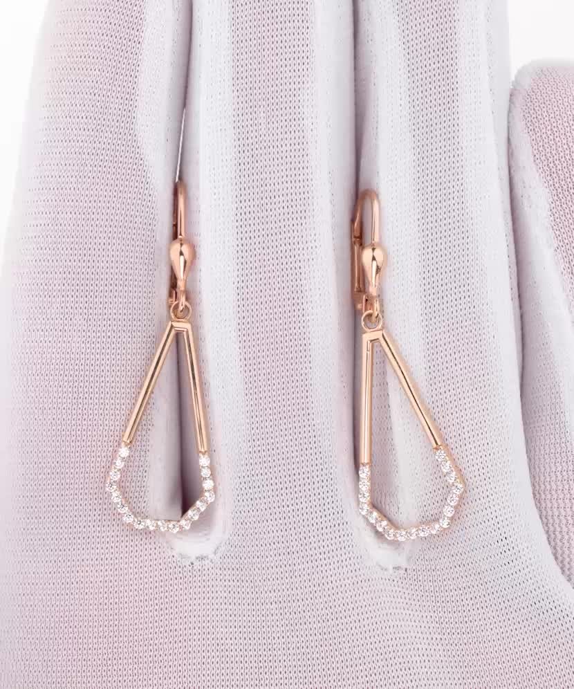 Kultaiset korvakorut zirkoneilla