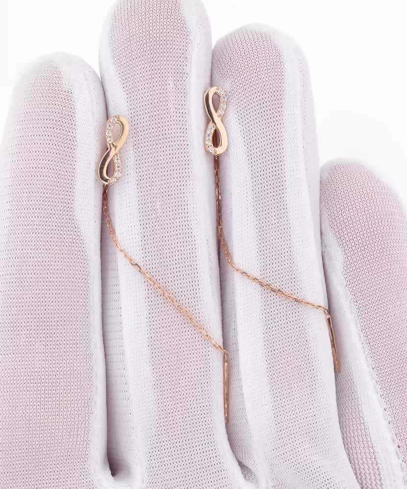 Gold earrings with zircons "infinity"