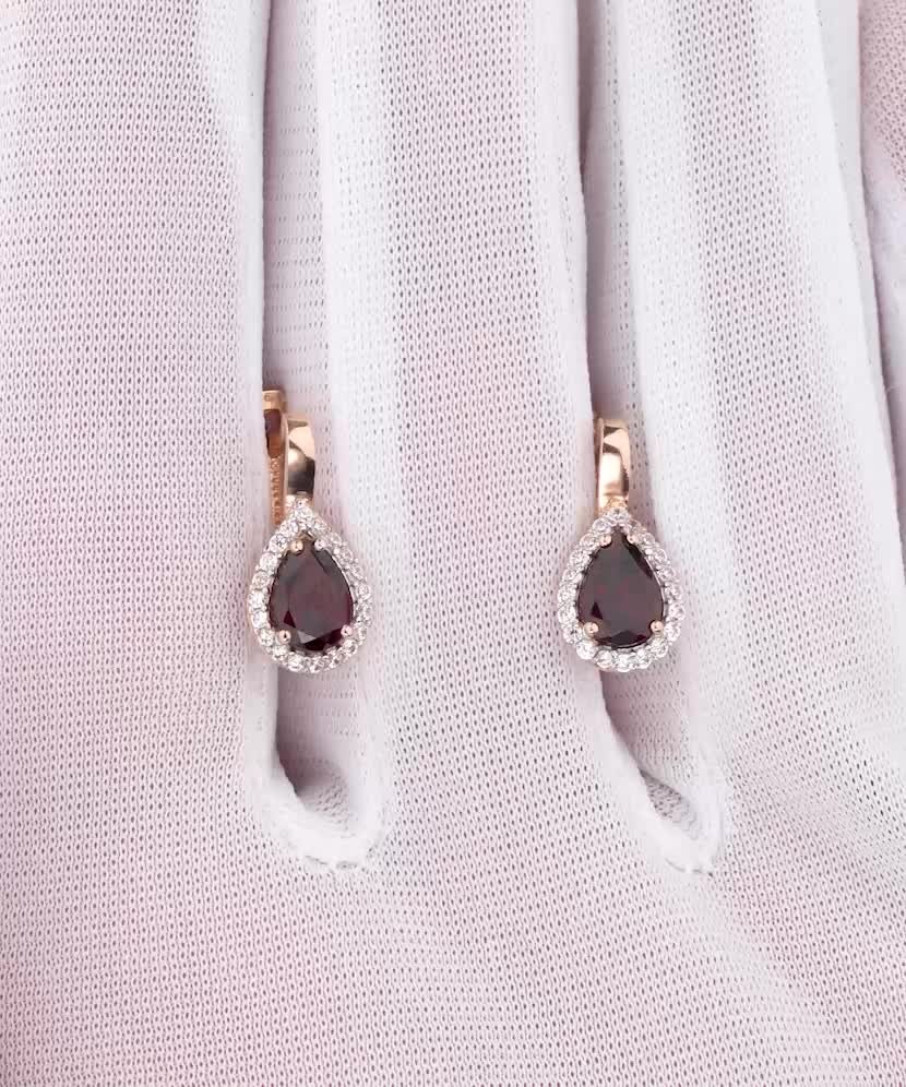Gold earrings with garnet and zircons