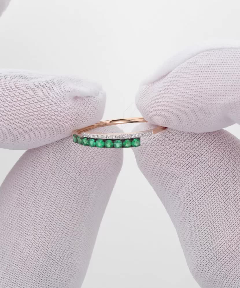 Gold ring with emeralds and diamonds